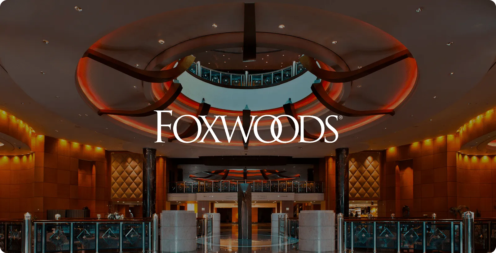 Foxwoods casino lobby under a glowing orange ceiling with the Foxwoods logo