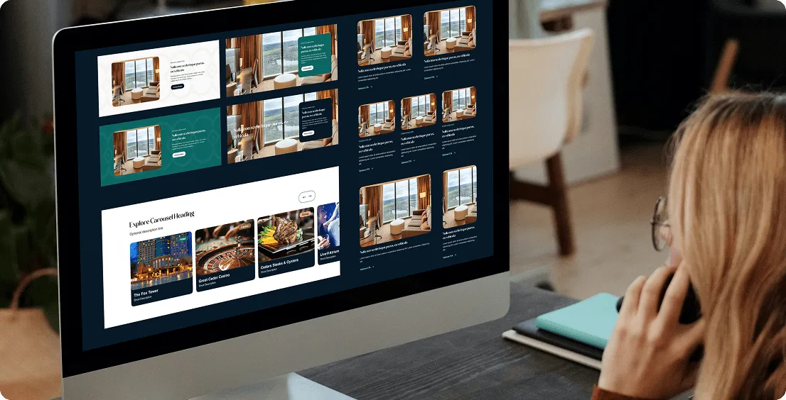 Monitor showing Foxwoods page layout designs with room images and an Explore carousel