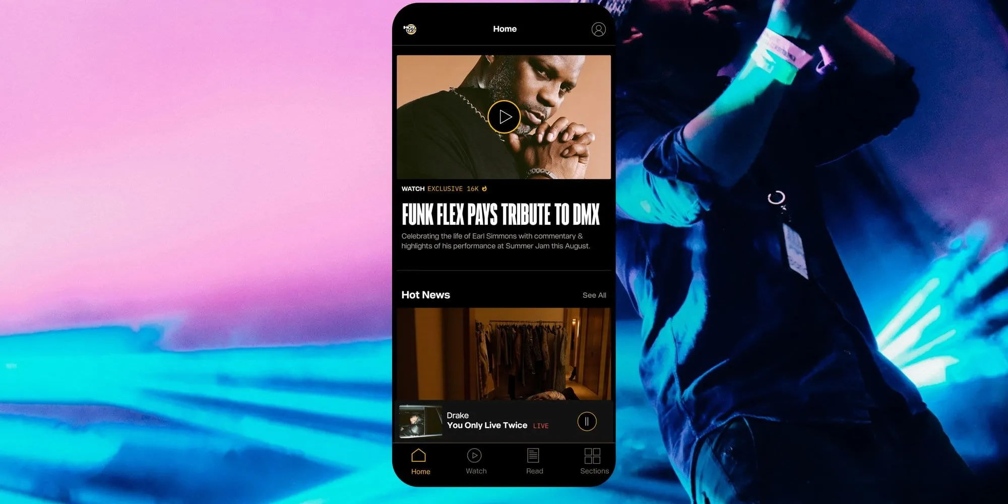 A Hot 97 app home screen on a phone, with a featured video story and a Hot News list, over a purple and blue concert photo.