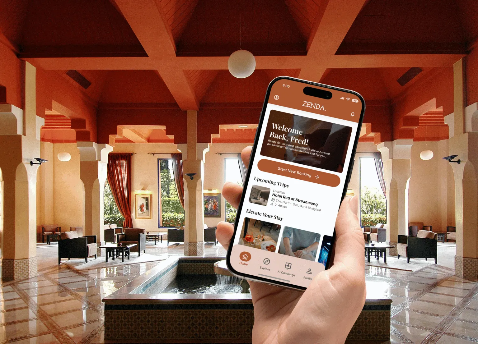 Hand holding a phone with a Zenda welcome screen in a warm, arched hotel lobby