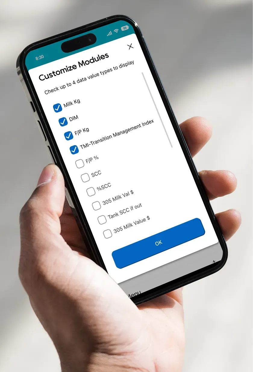 A phone showing the Lactanet Customize Modules screen, a checklist of up to eight data values to display, with an OK button.
