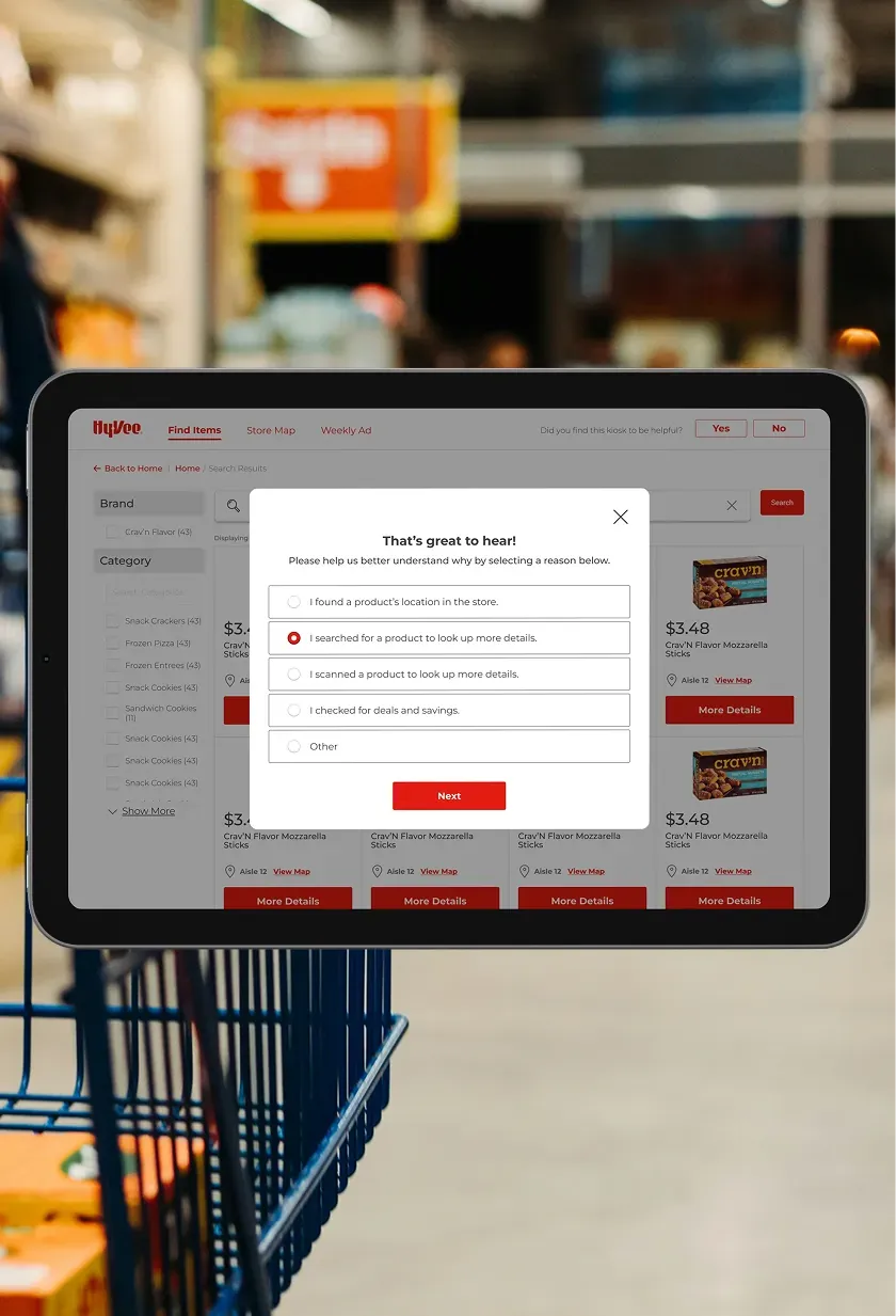 A Hy-Vee kiosk search results screen with a pop-up that asks how the kiosk helped the shopper.