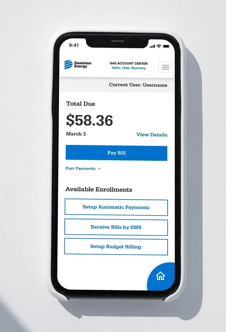 A gas account screen on a phone showing the total due, a Pay Bill button and options for automatic payments, bills by text message and budget billing.