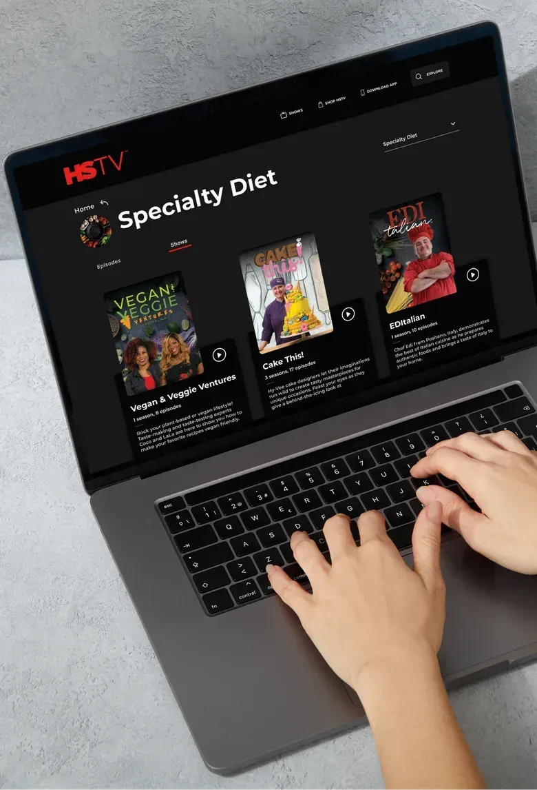 A laptop showing the HSTV web app Specialty Diet page with a row of show posters.