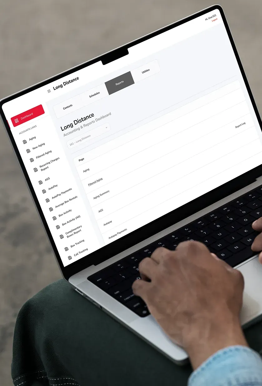 The accounting and reports dashboard on a laptop, listing reports such as aging, payments, and box activity.