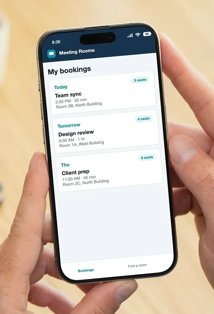 A phone showing the My bookings screen with upcoming room bookings by date, time, room and seat count.