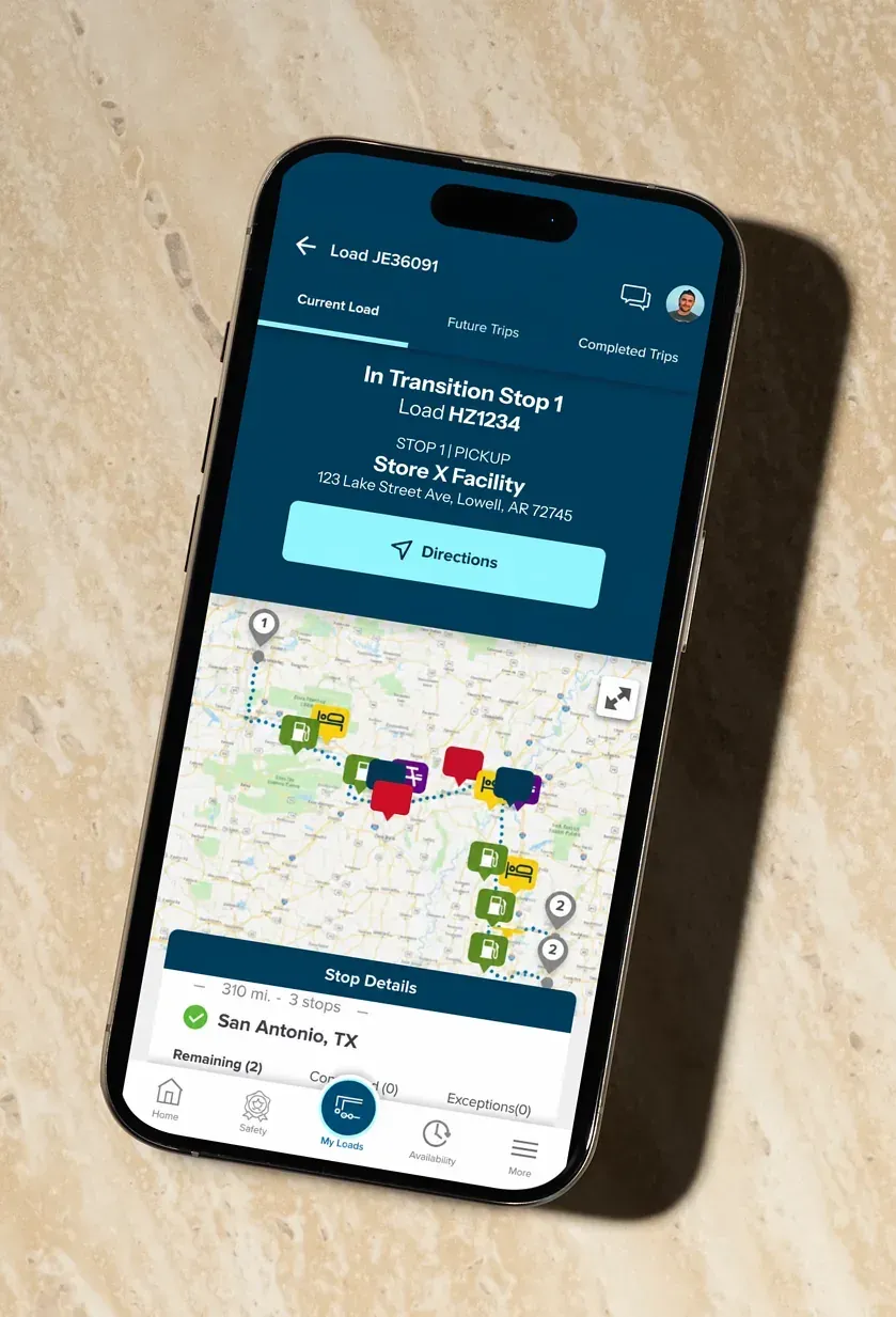 The driver app on a phone showing a load in transit to its first stop, with a Directions button and a route map.