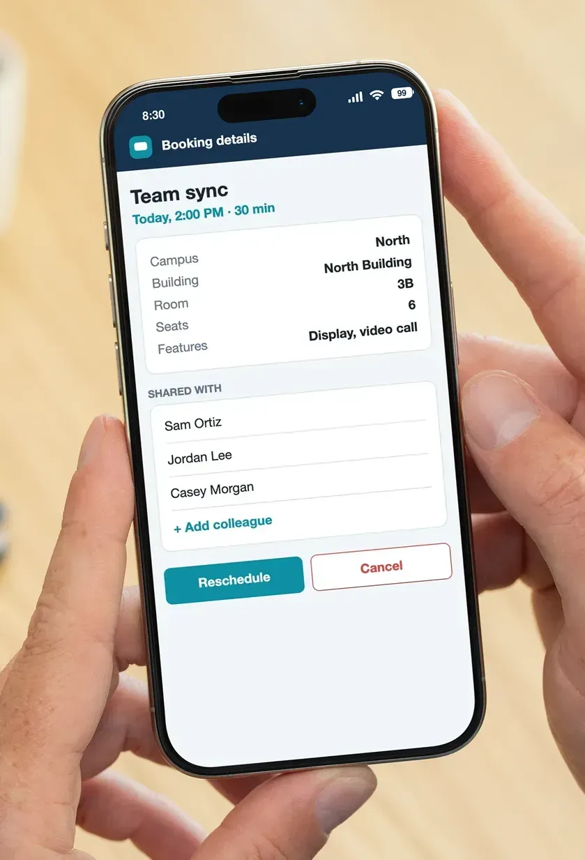 A phone showing a booking detail with room information, shared colleagues, and Reschedule and Cancel buttons.