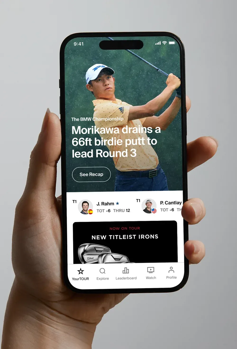 The app home screen with a full-bleed highlight story, a player on the course, and a strip of leaders with their scores.