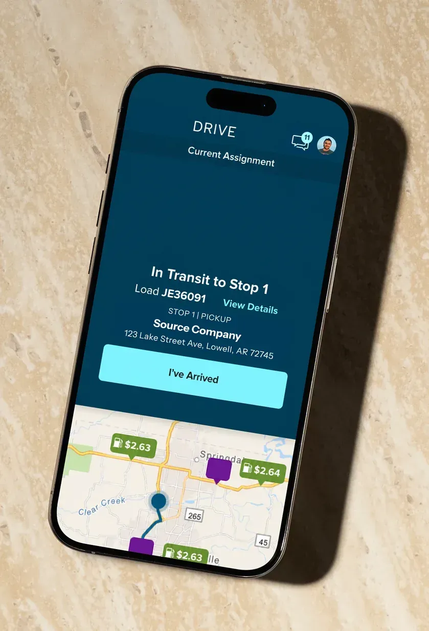 The driver app on a phone showing the current assignment in transit to stop one, with an I've Arrived button and a map.