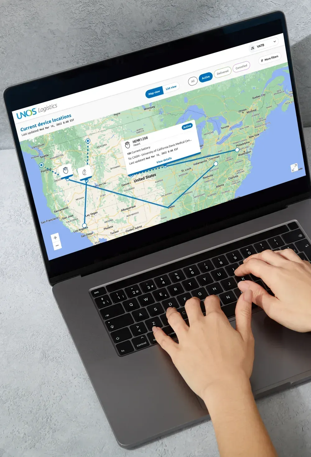 The map view on a laptop, showing routes across the United States and a detail card for one organ in transit with its destination and last update.