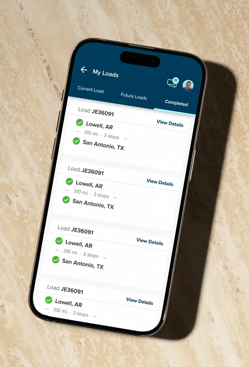 The driver app's My Loads list on a phone, with tabs for current, future and completed loads and a card for each trip.