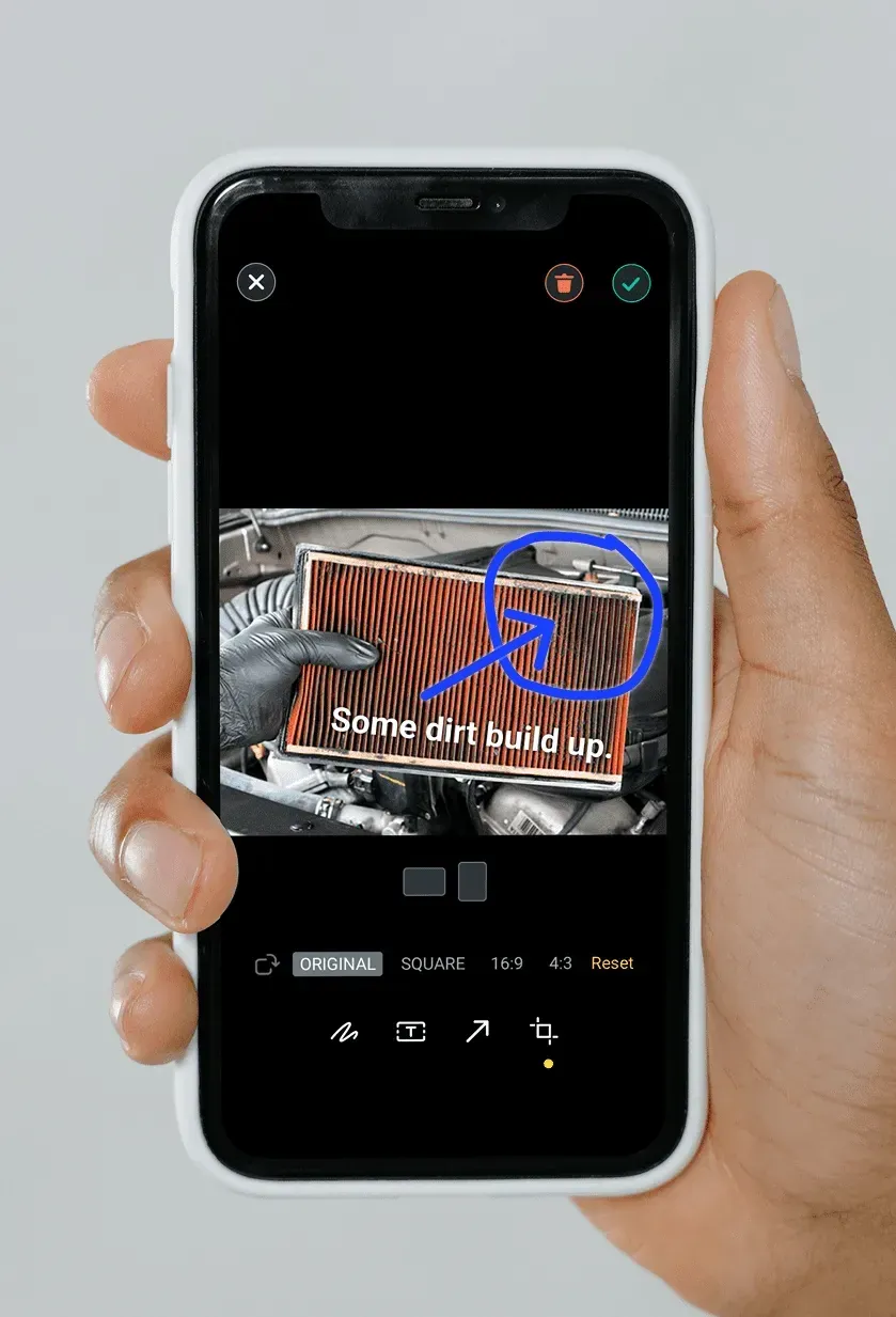 The camera view with a photo of a vehicle part marked up before saving.