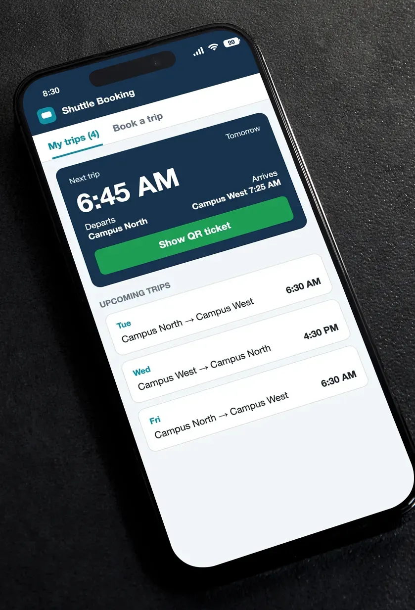 A phone showing the rider app's next shuttle trip, a Show QR ticket button and a list of upcoming trips.